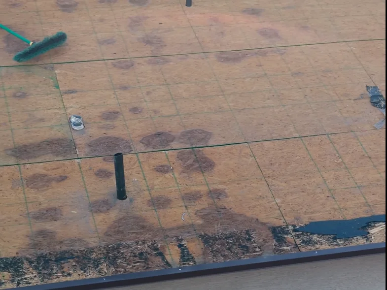 Storm damaged roof decking found under the tile